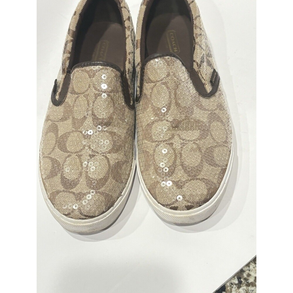 Coach signature logo slip-on sneakers featuring a brown 9B